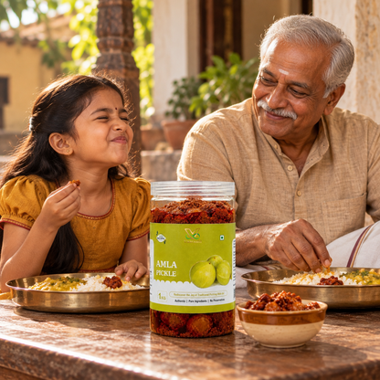 Grandfather and granddaughter enjoying a meal with Vaaraahi Amla Pickle
