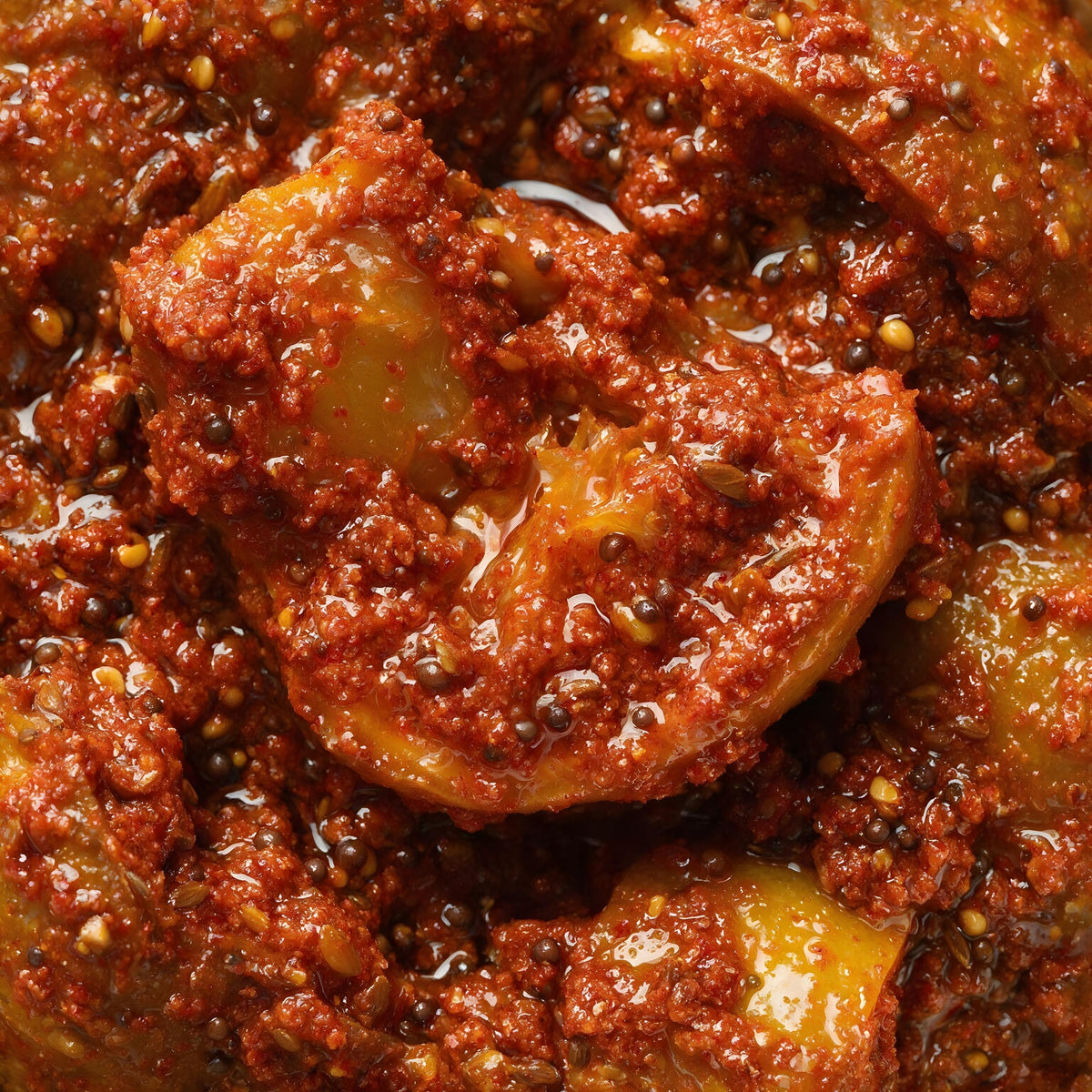 Close-up of Vaaraahi Lemon Pickle with lemon pieces coated in traditional spices