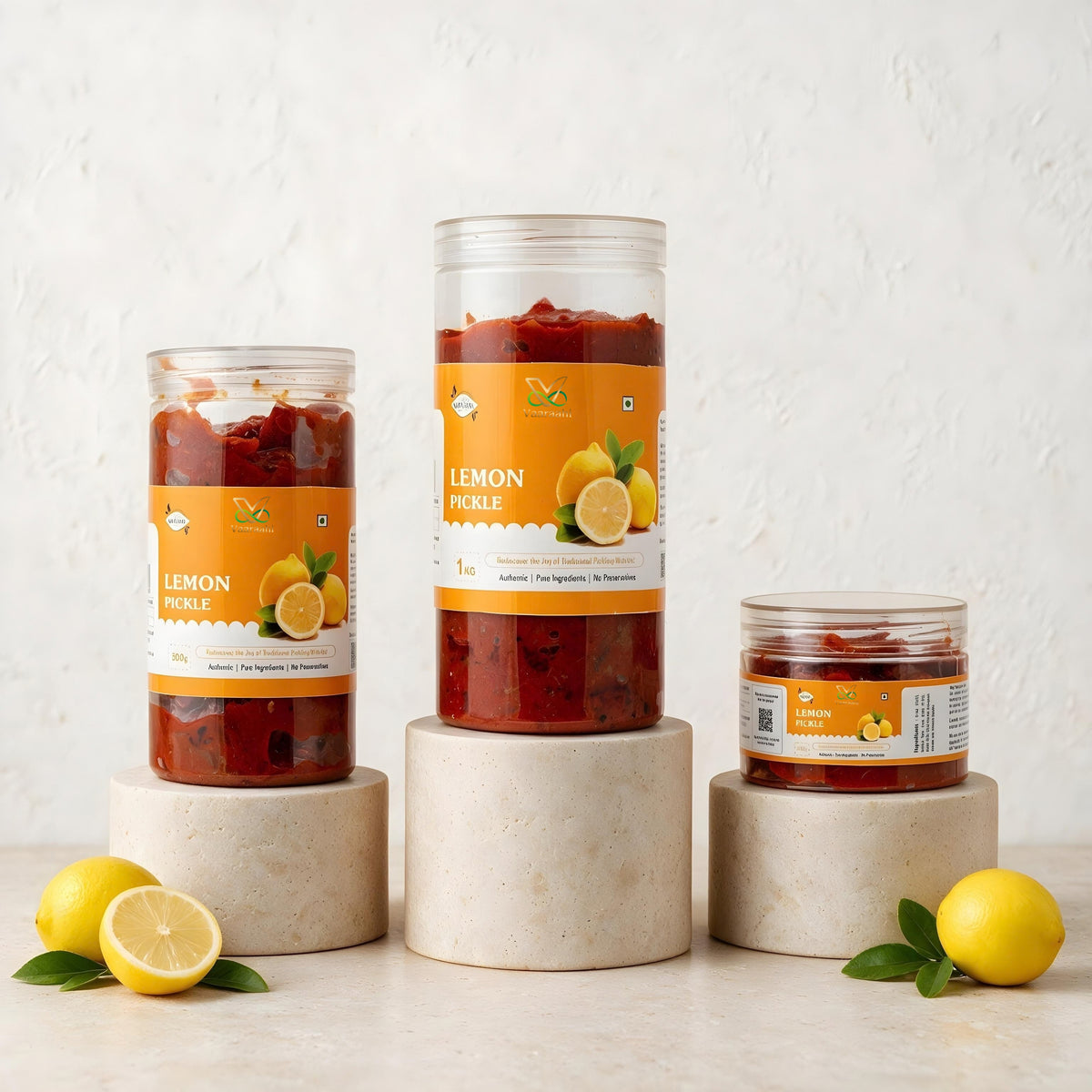 Vaaraahi Lemon Pickle jars in different pack sizes with fresh lemons