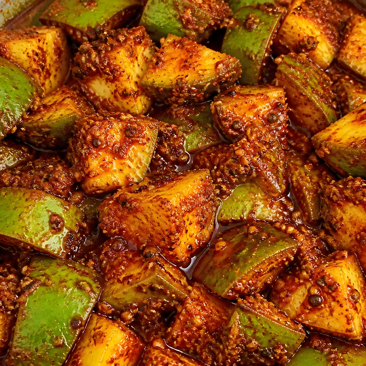 Close-up of Vaaraahi Mango Pickle with raw mango pieces coated in traditional spices