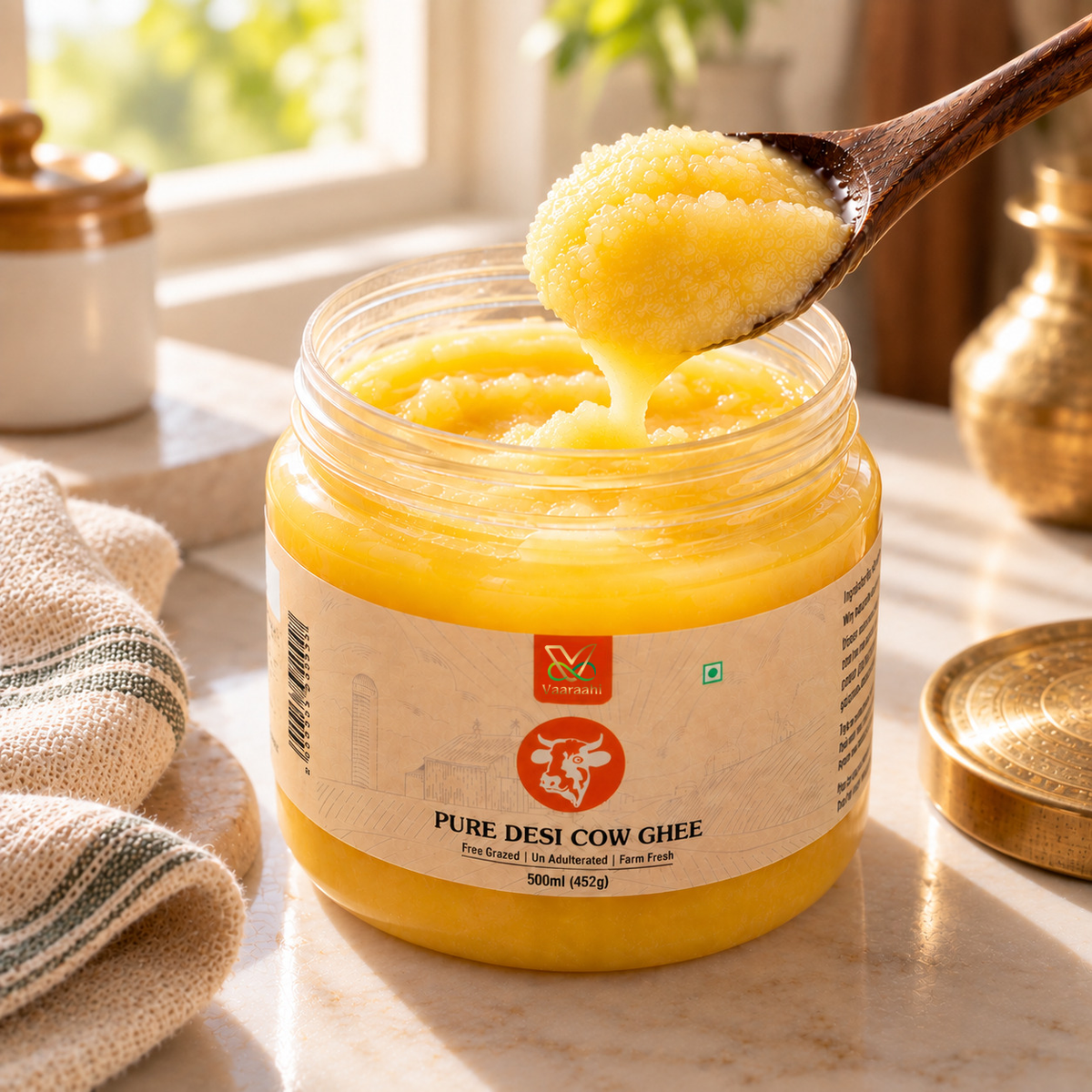 Vaaraahi Pure Desi Cow Ghee texture with a spoon
