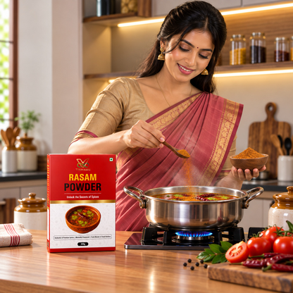 Vaaraahi Rasam Powder being added to rasam in a modern Indian kitchen