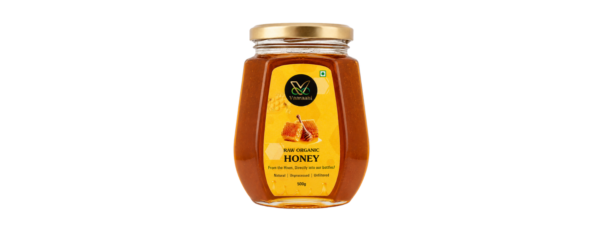 Vaaraahi Raw Organic Honey in a 500g glass jar, labelled natural, unprocessed and unfiltered.