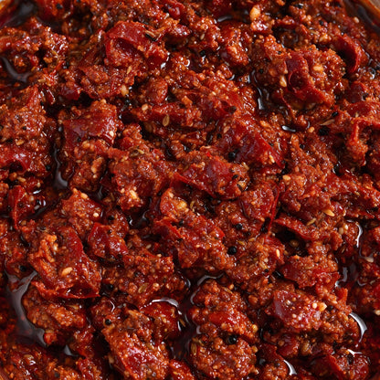 Close-up of Vaaraahi Red Chilli Pickle with chilli pieces and traditional spices